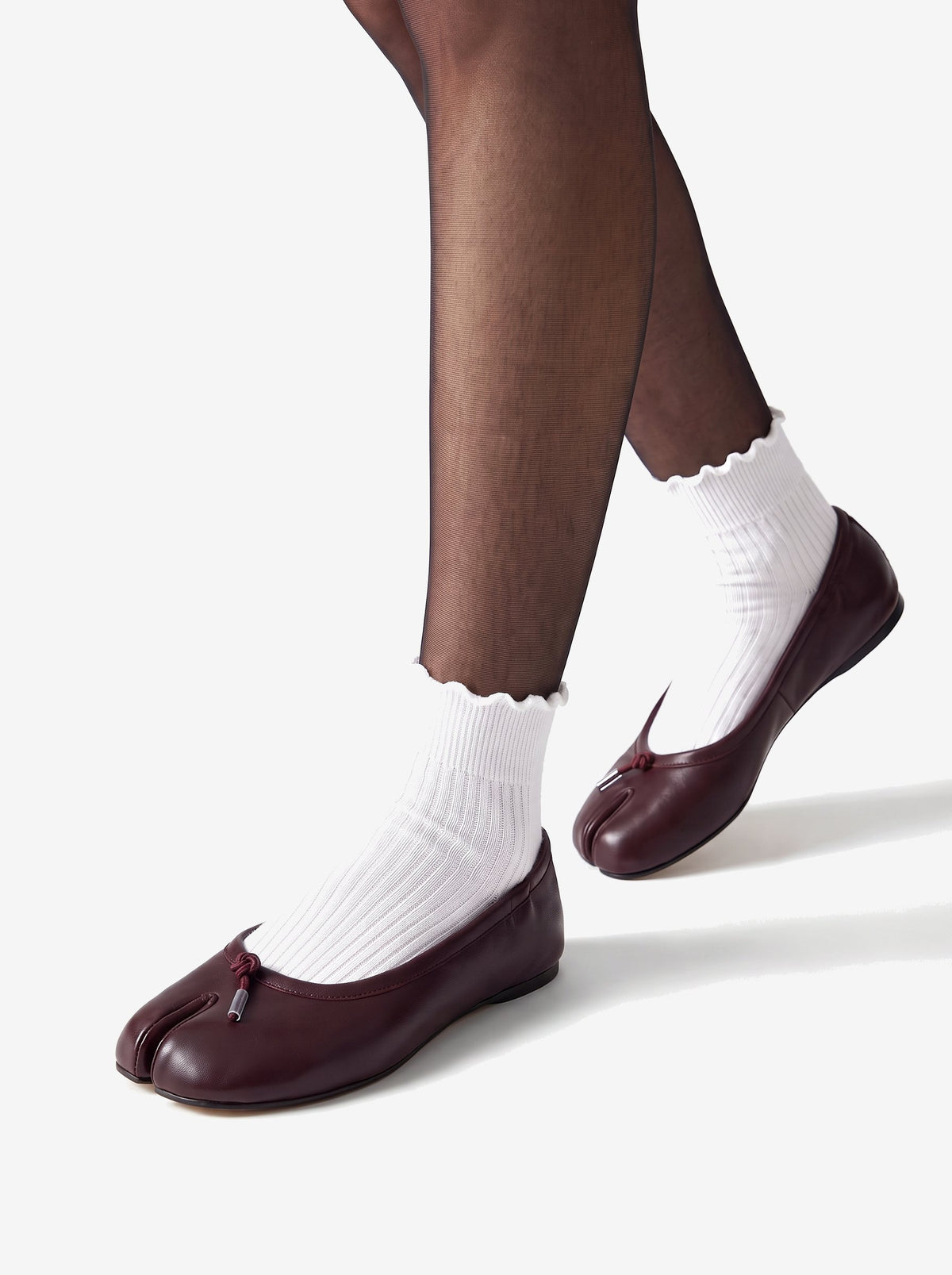 The New York Split-Toe Flat — Oxblood, worn with sheer tights and ruffle socks