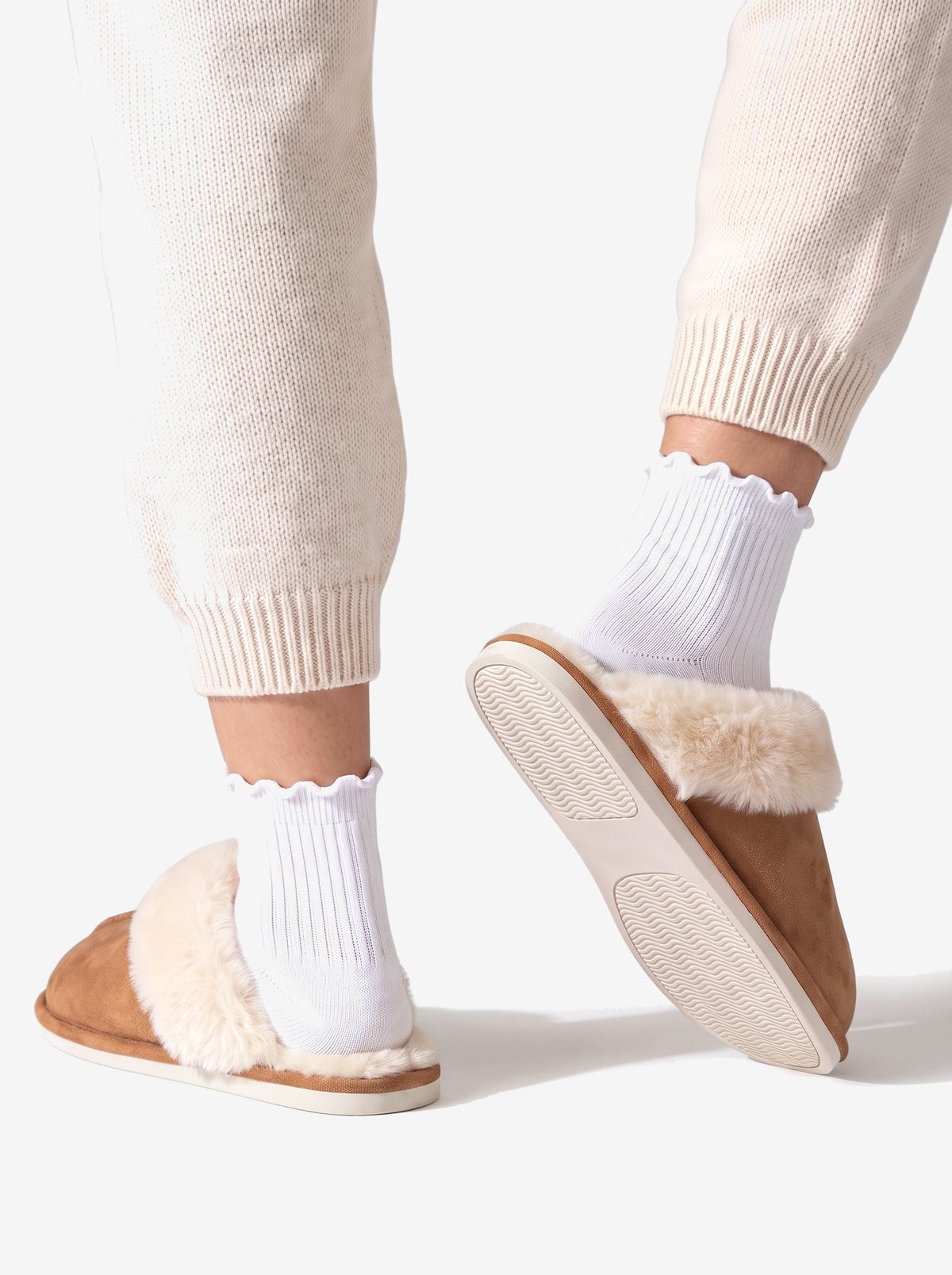 The Courchevel Slipper in Chestnut, the thin stitched sole
