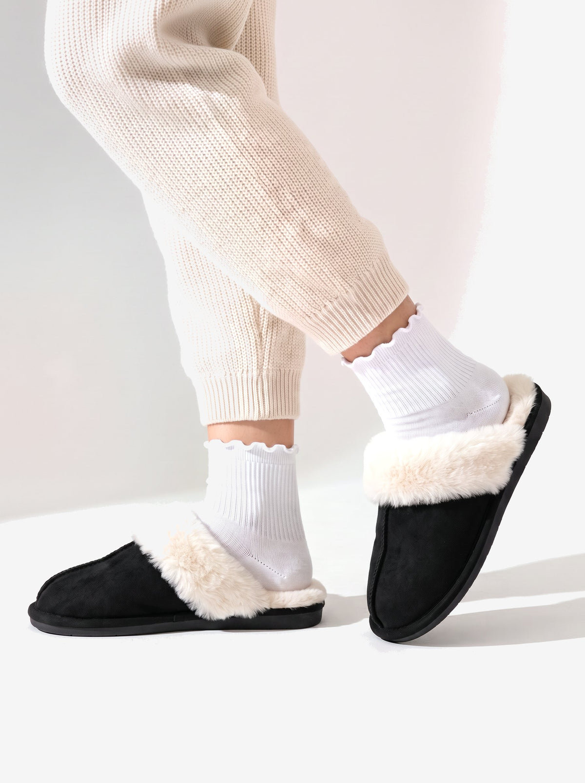The Courchevel Slipper in Black, the low open back mid step
