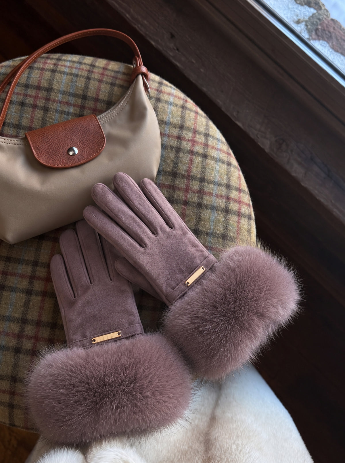 The Paris Glove — Purple Yam, with a hobo bag on a plaid chair